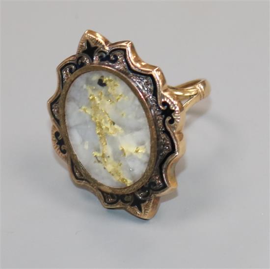 An early 20th century 9ct gold, quartz with iron pyrites and black enamel oval ring, size L.